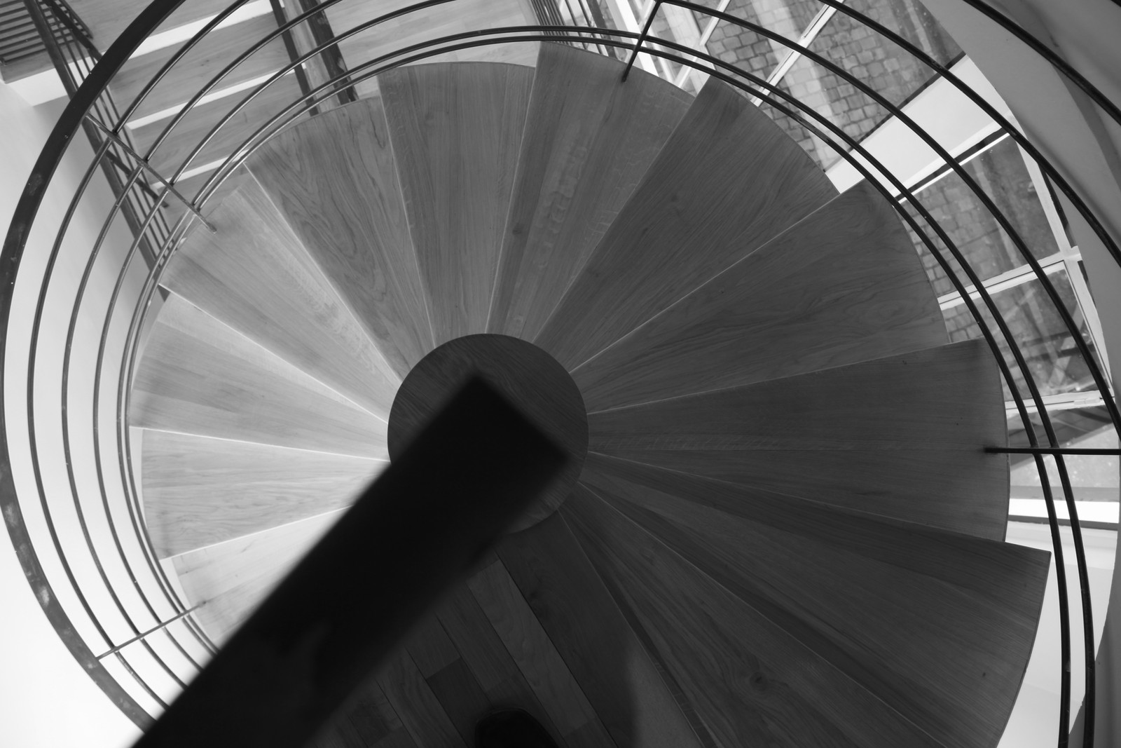 Looking down a curving spiral staircase from above