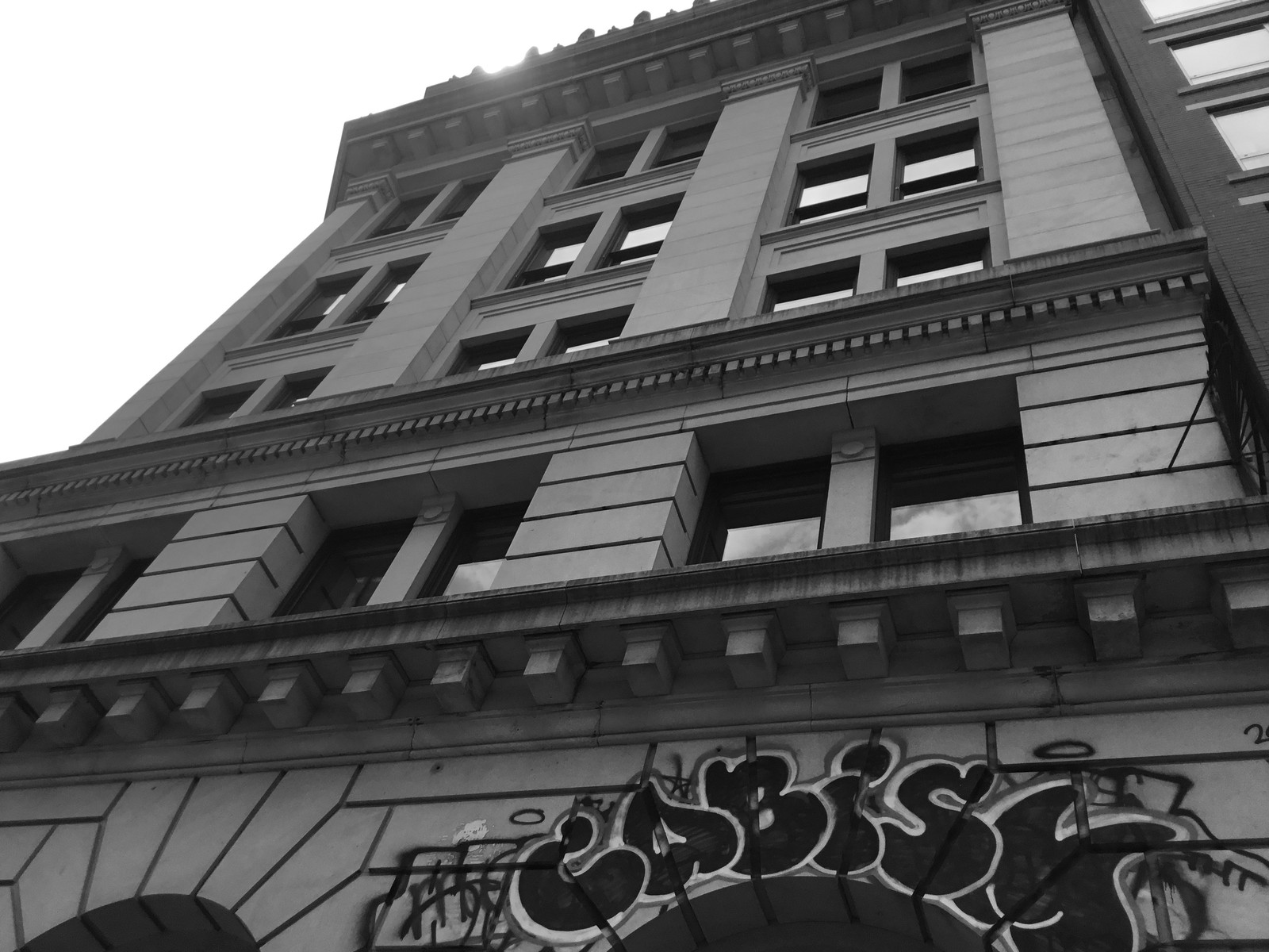 Looking up at the upper floors and cornice of 190 Bowery