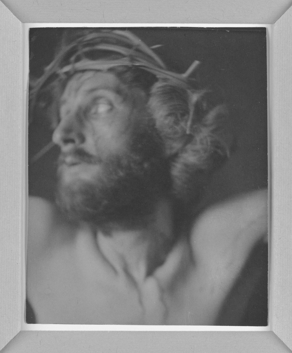 One panel from The Seven Words, a close portrait of F. Holland Day as Christ wearing a crown of thorns