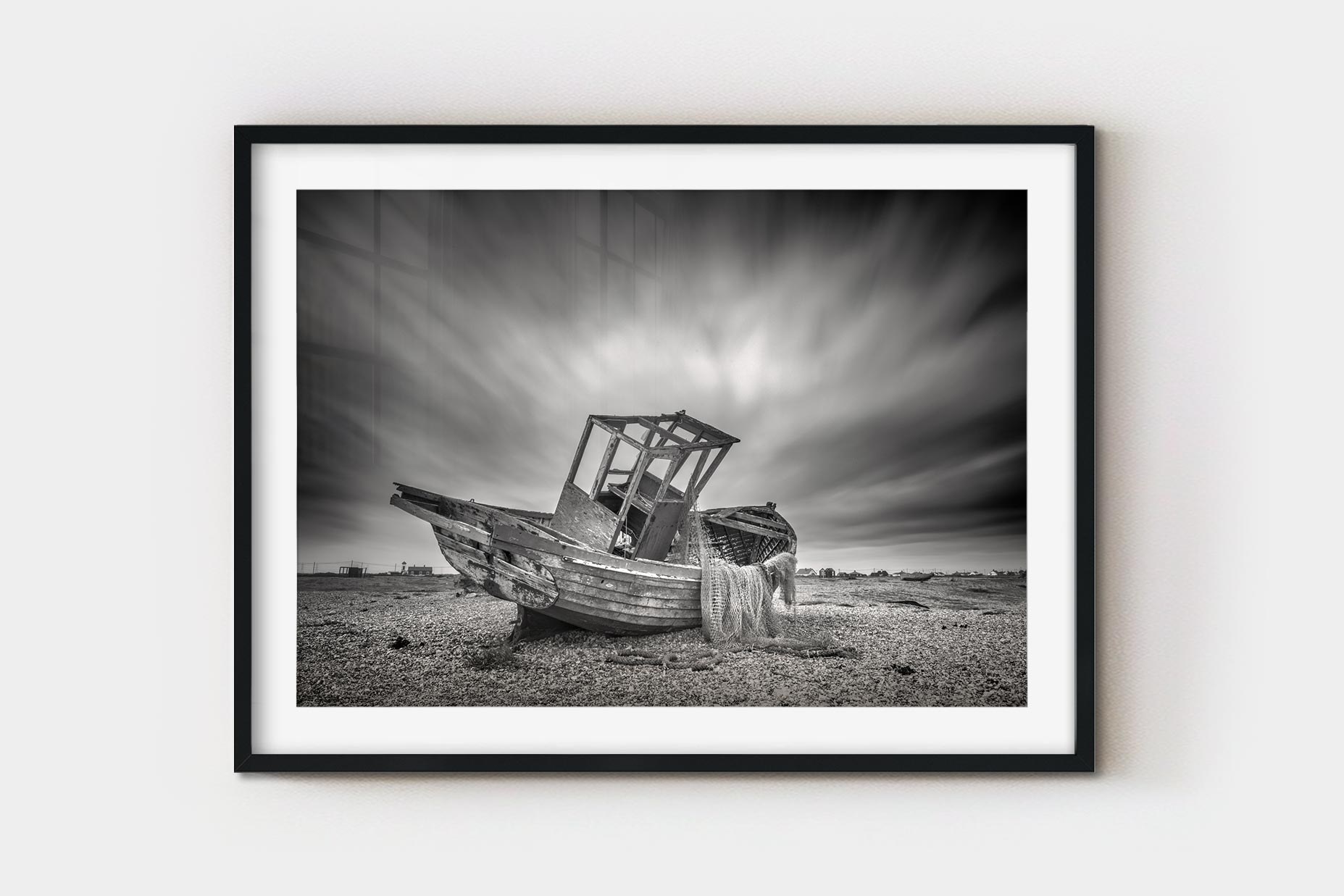 The same derelict fishing boat photograph presented as a framed print behind a white mat