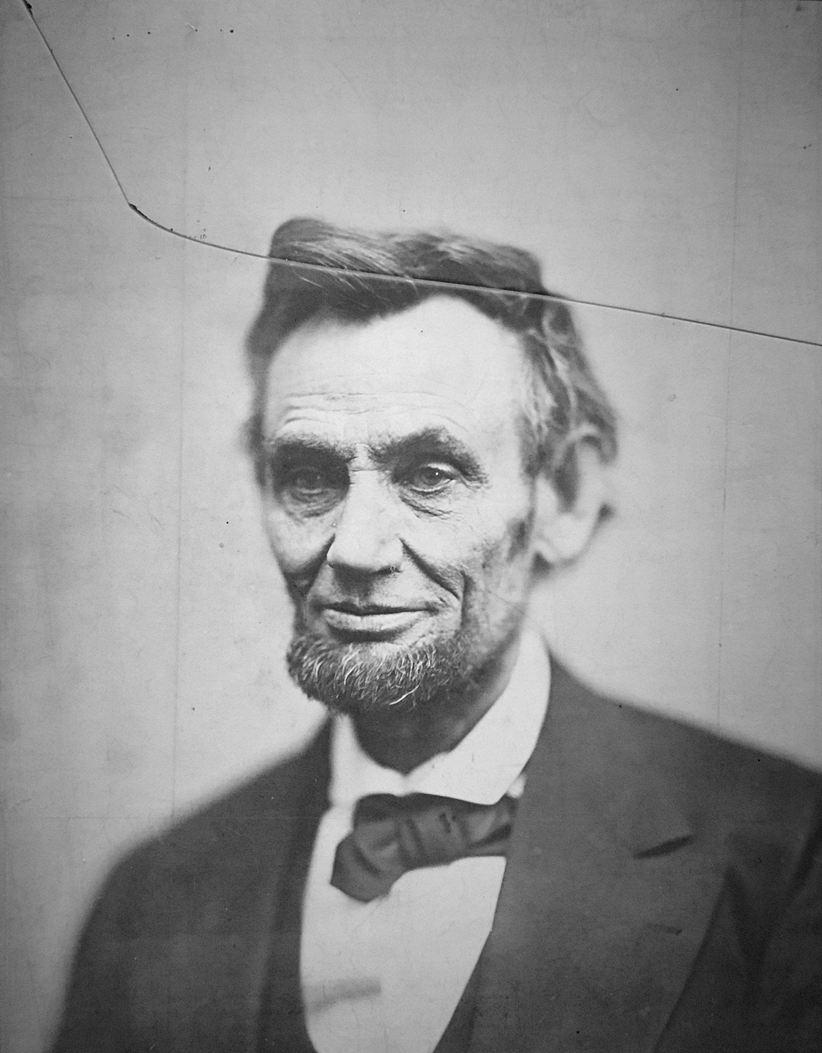Alexander Gardner’s 1865 portrait of Abraham Lincoln, with a crack running across the top of the plate