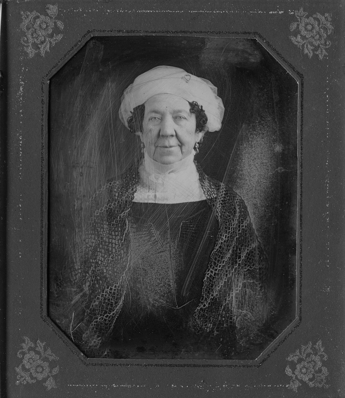 An 1846 daguerreotype of Dolley Madison in a turban and lace collar, in its decorative case
